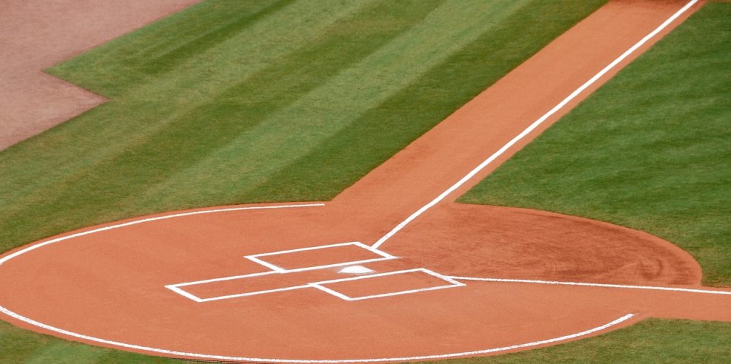 A baseball field with the base and pitchers mound.